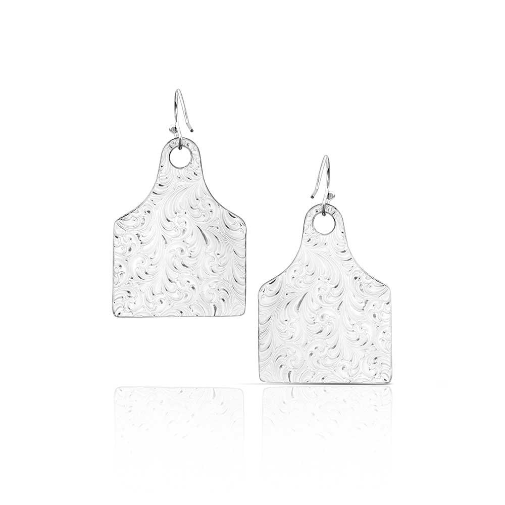 USA-made silver Western dangle earrings by Montana Silversmiths with engraved cow tag designs and classic ranch-inspired style.