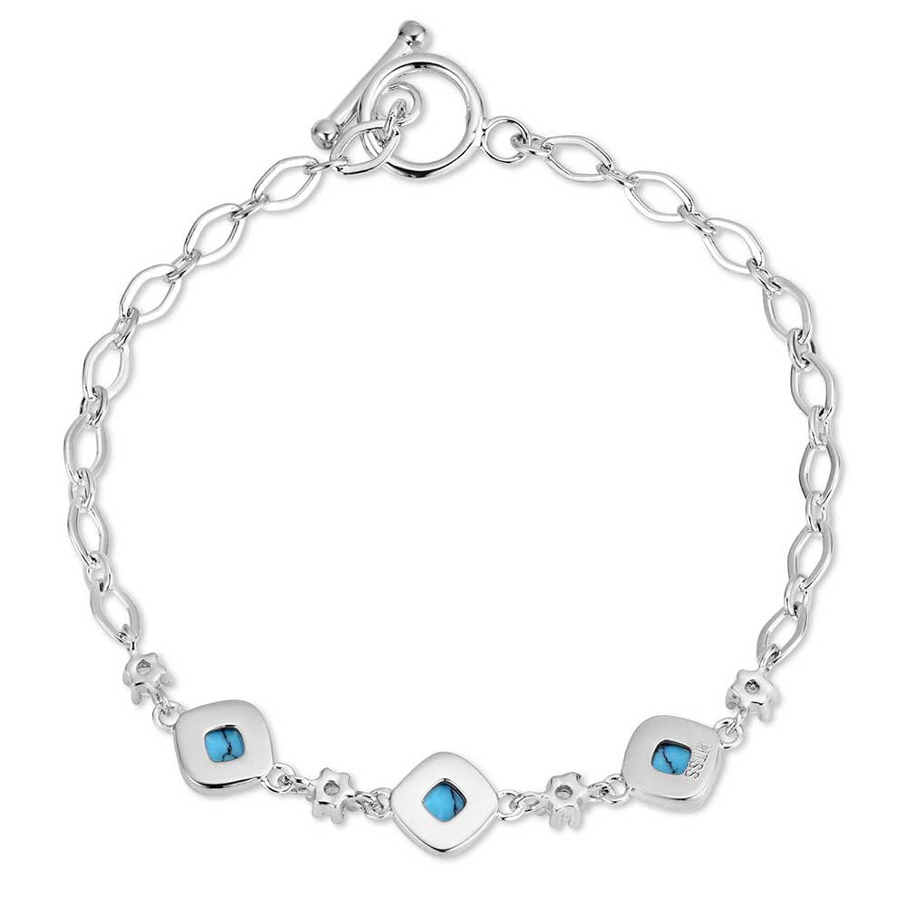 Western turquoise crystal toggle bracelet by Montana Silversmiths with polished silver finish and elegant Southwestern styling.