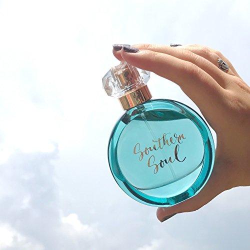 
                  
                    Hand Holding Bottle of Tru Western Women's Southern Soul Perfume
                  
                