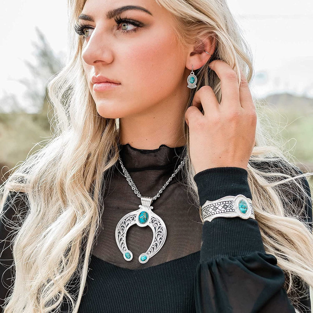 
                  
                    Woman Wearing Montana Silversmiths Romancing the Stone Squash Blossom Jewelry Set
                  
                