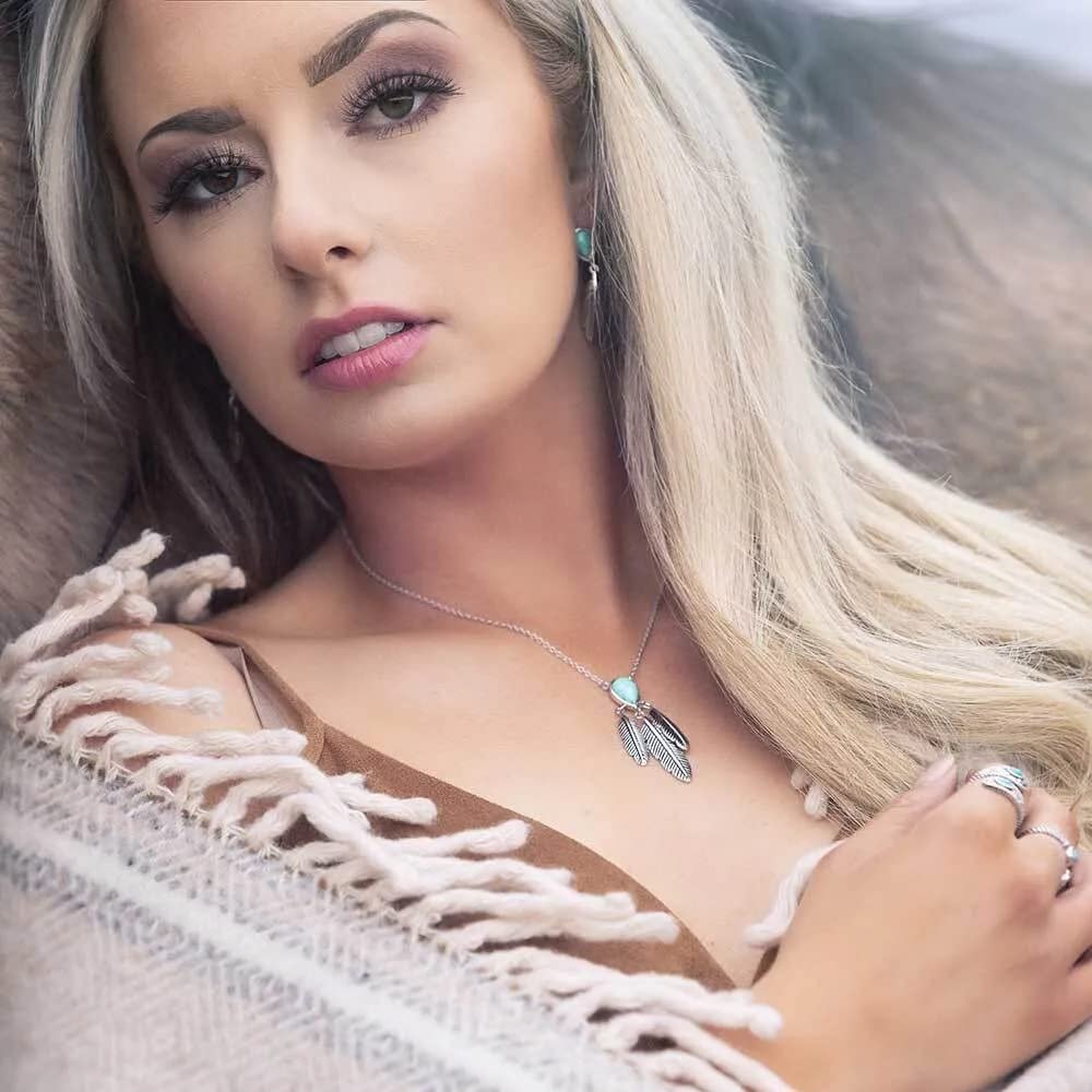 
                  
                    Woman Wearing Montana Silversmiths Women's Feather Necklace, Three Feathers
                  
                