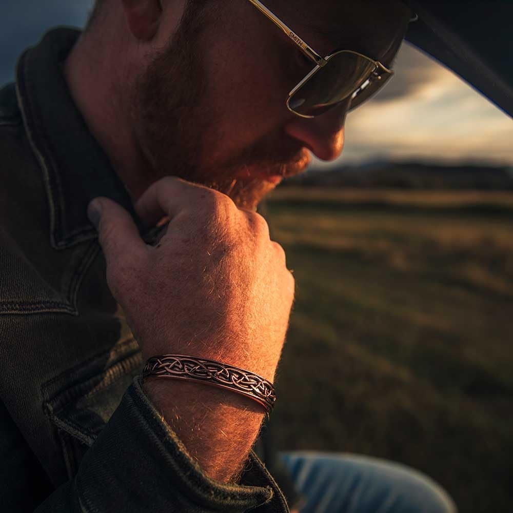 
                  
                    Man Wearing Montana Silversmiths Cathedral Rock Copper Cuff Bracelet
                  
                