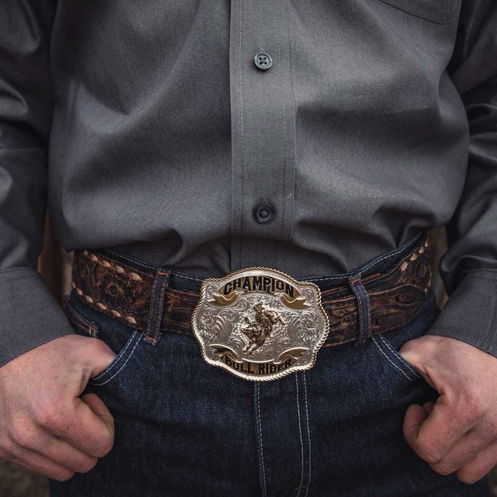 
                  
                    Man Wearing Montana Silversmiths Scalloped Champion Bullriding Belt Buckle
                  
                