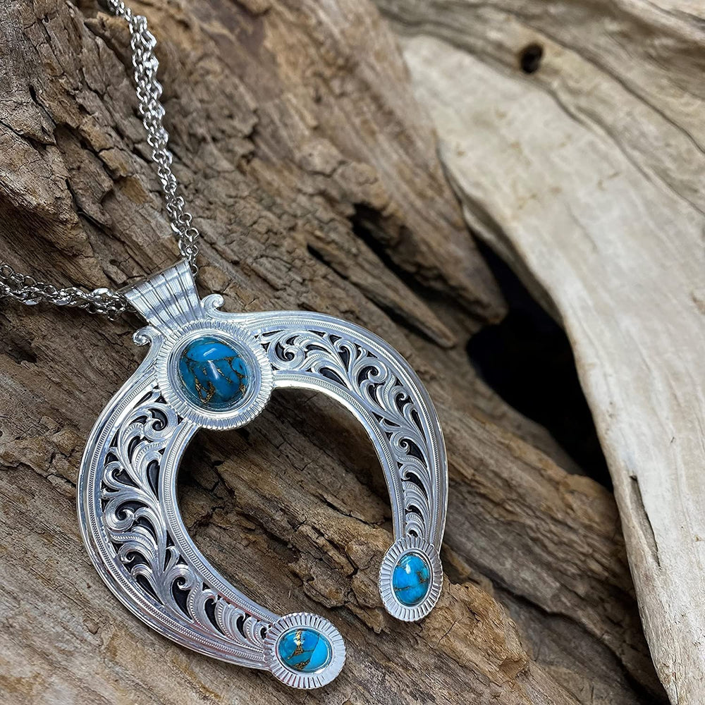 
                  
                    Montana Silversmiths Romancing the Stone Squash Blossom Necklace Against Wooden Background
                  
                