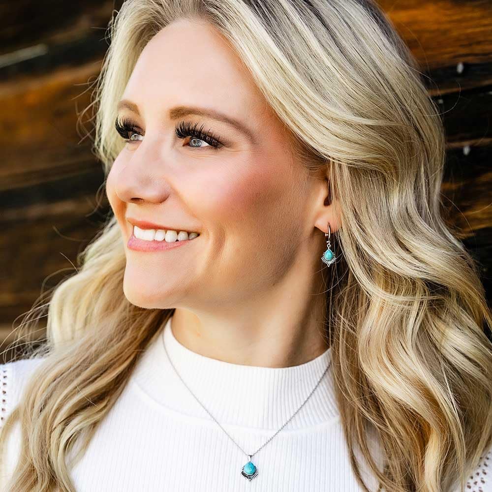 
                  
                    Woman Wearing Montana Silversmiths Women's Simple Flourish Turquoise Earrings
                  
                