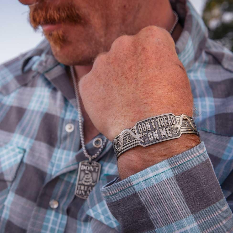 Man Wearing Montana Silversmiths Men's Don't Tread On Me Cuff Bracelet