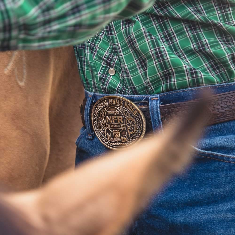 
                  
                    Man Wearing Montana Silversmiths 2021 National Finals Rodeo Oval Belt Buckle
                  
                