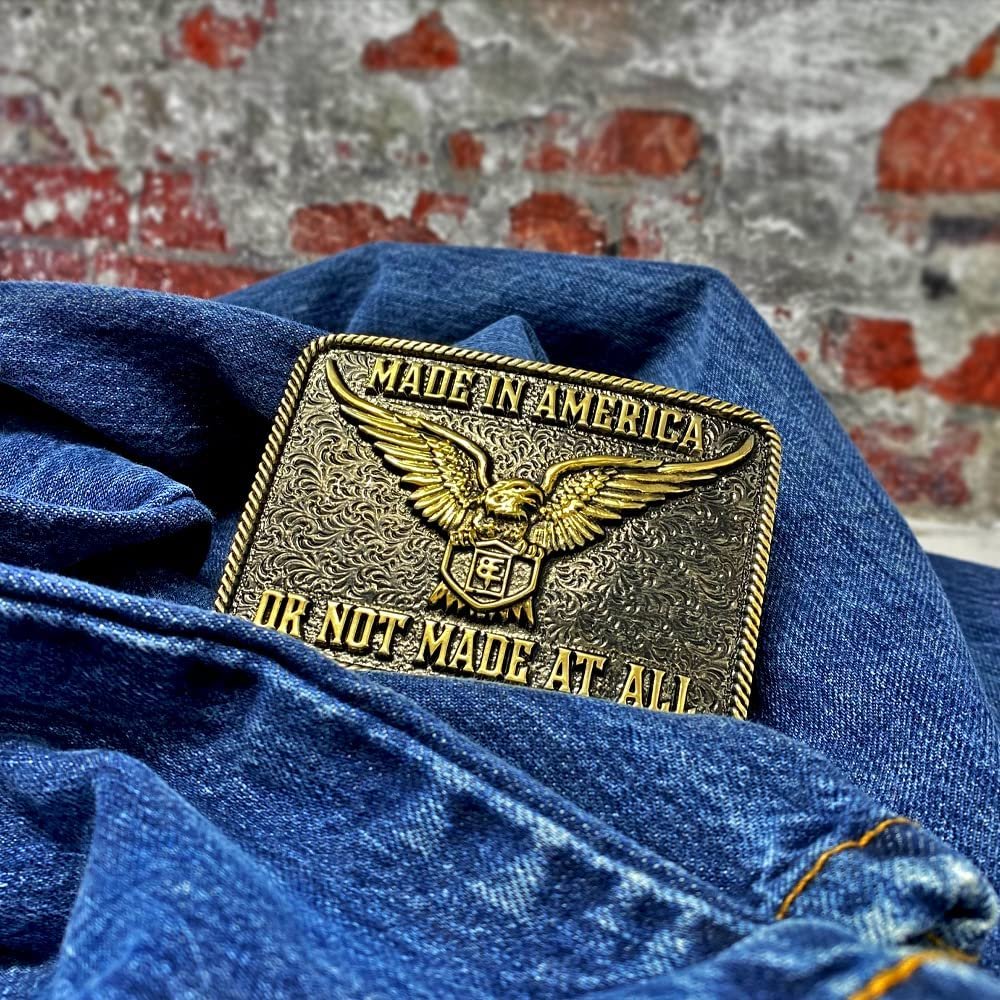 
                  
                    Montana Silversmiths Southwest Collection Attitude Western Belt Buckle, Made in America Against Denim Background
                  
                