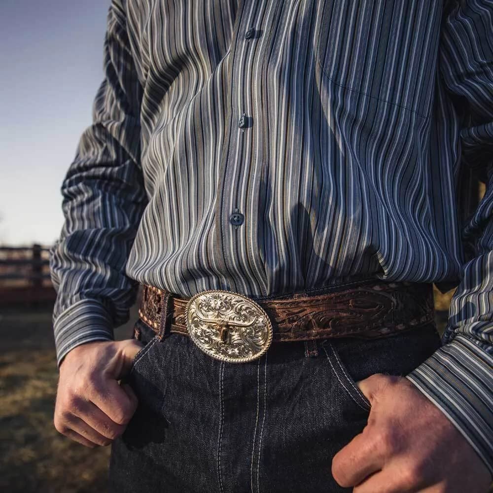 
                  
                    Man Wearing Montana Silversmiths Small Two-Tone Engraved Western Buckle With Longhorn
                  
                