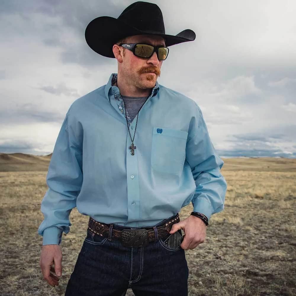 
                  
                    Cowboy Wearing Montana Silversmiths Dawn's Early Light Gunmetal Belt Buckle
                  
                