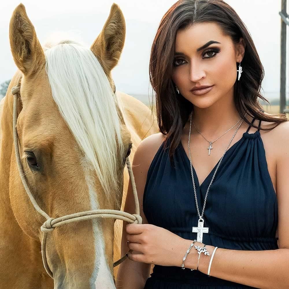 
                  
                    Woman Wearing Montana Silversmiths Women's Silver Artistry Faith Cross Earrings
                  
                