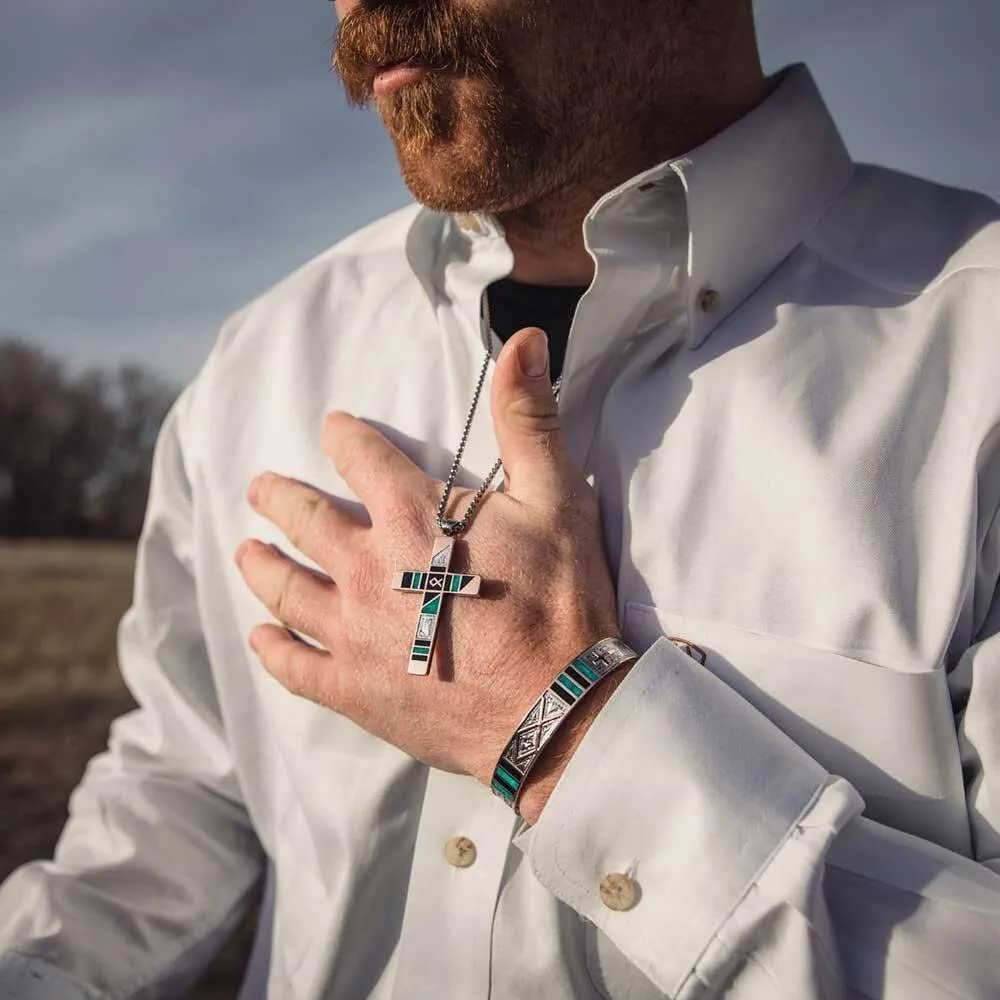 
                  
                    Man in White Shirt Wearing Montana Silversmiths Antiqued Stainless Barbed Wire Cross Necklace
                  
                