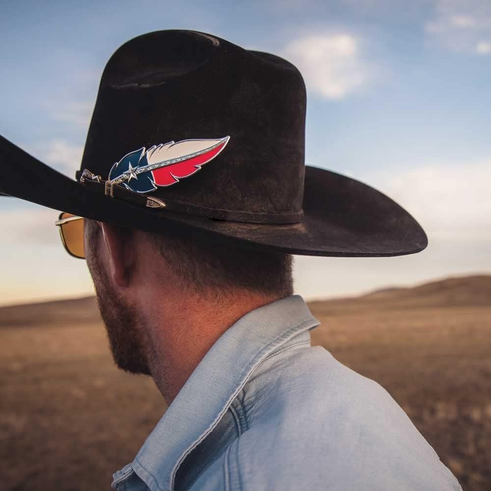 
                  
                    Cowboy Wearing Montana Silversmiths Texas Flag Hat Feather
                  
                