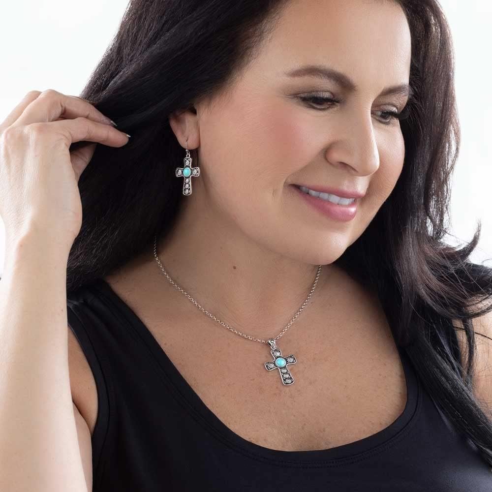 
                  
                    Woman Wearing Montana Silversmiths Women's Bold in Faith Turquoise Cross Necklace
                  
                