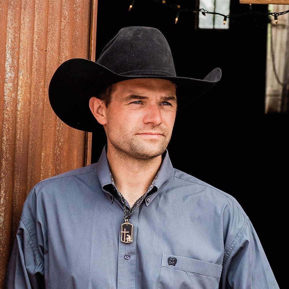 
                  
                    Cowboy Wearing Montana Silversmiths Men’s Kneeling at the Cross Dog Tag Necklace
                  
                