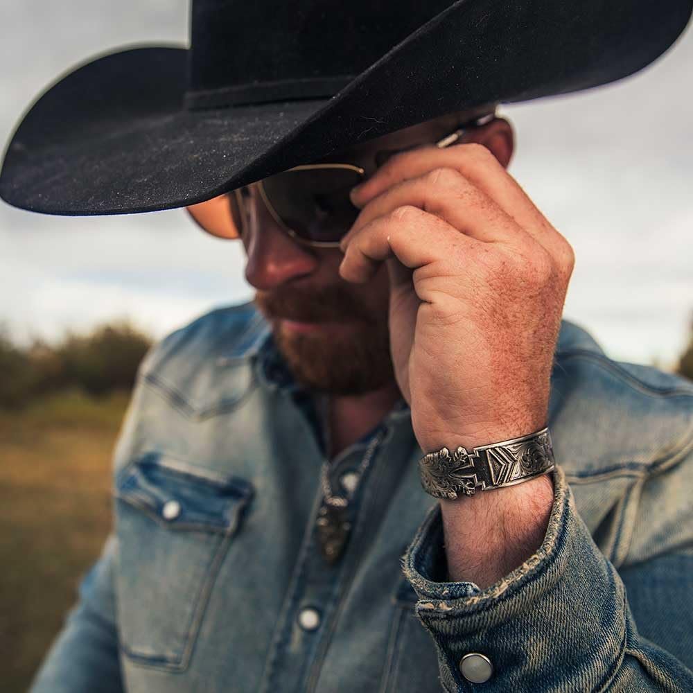 Cowboy Wearing Montana Silversmiths Men's Old West Arrowhead Cuff Bracelet
