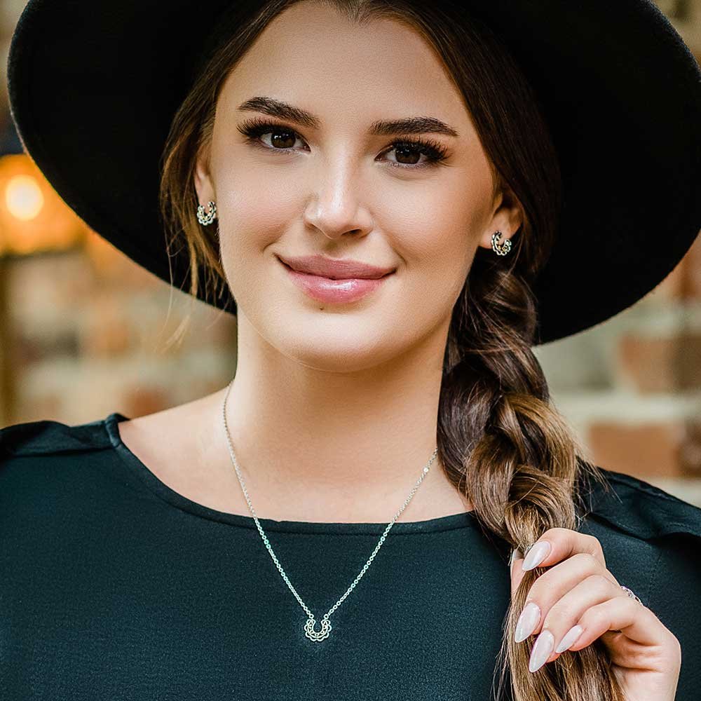 
                  
                    Woman Wearing Montana Silversmiths Lucky Montana Gold Horseshoe Jewelry Set
                  
                