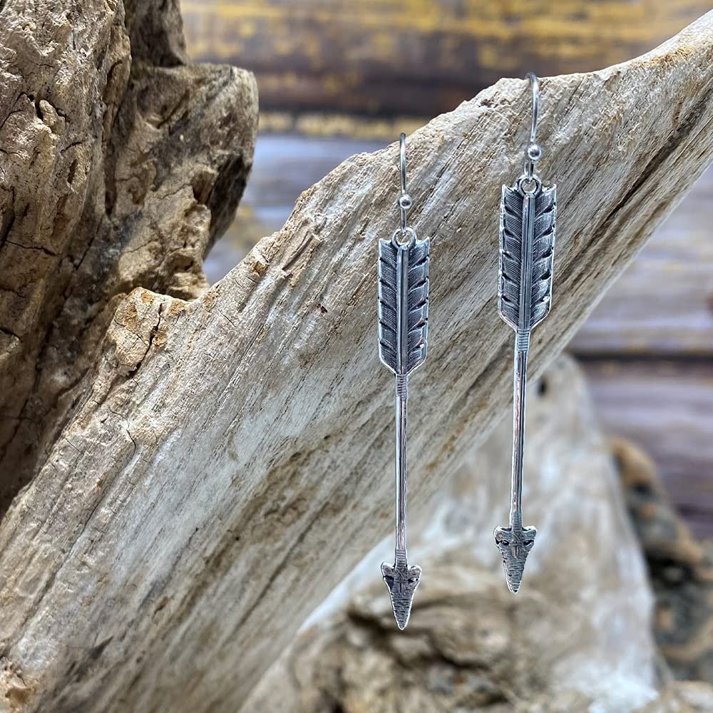 
                  
                    Pair of Montana Silversmiths Women's Timber Ridge Arrow Earrings, Hanging From Driftwood
                  
                