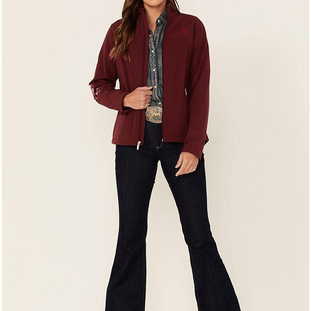 
                  
                    Woman Wearing Ariat Women's New Team Softshell Jacket in Zinfandel/Carmen Geo
                  
                