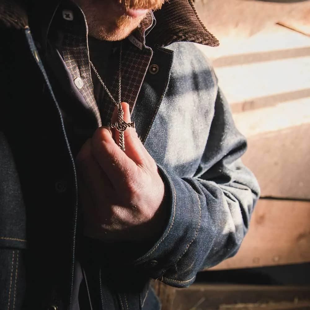 
                  
                    Man Wearing Montana Silversmiths Antiqued Stainless Barbed Wire Cross Necklace
                  
                