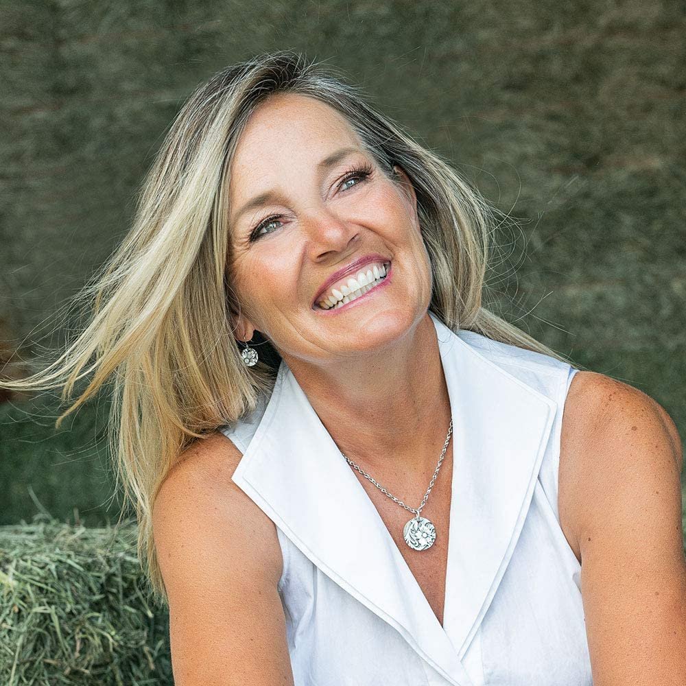 
                  
                    Woman in White Top Wearing Montana Silversmiths Art of the Buckle Jewelry Set
                  
                