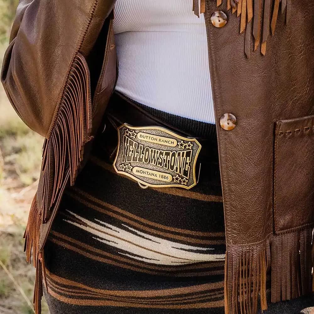 
                  
                    Woman Wearing Montana Silversmiths x Yellowstone Collection Belt Buckle, With Dutton Ranch Yellowstone Montana Engraving
                  
                
