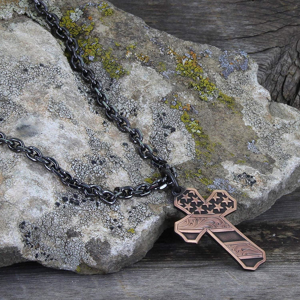 
                  
                    Montana Silversmiths Faded Glory Cross Necklace Against Rock Background
                  
                