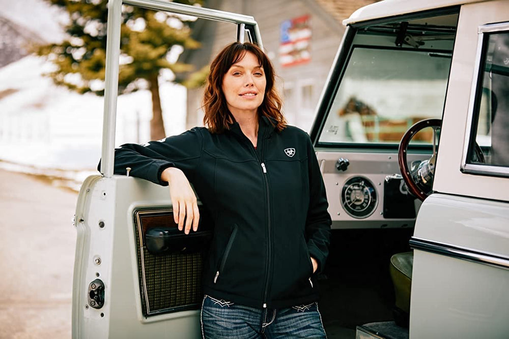 
                  
                    Woman Driver Posing in Ariat Women's New Team Softshell Jacket
                  
                